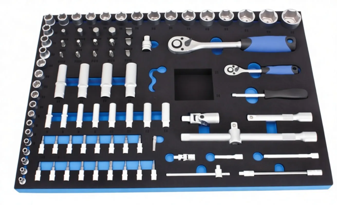 Top-down image of a black and blue foam tool tray with organized sockets, ratchets, extensions, adapters and bits