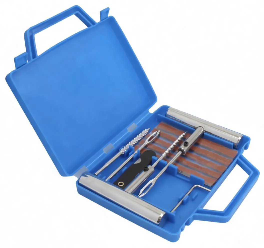 High-angle view of open blue tire repair kit with tools and plug strips
