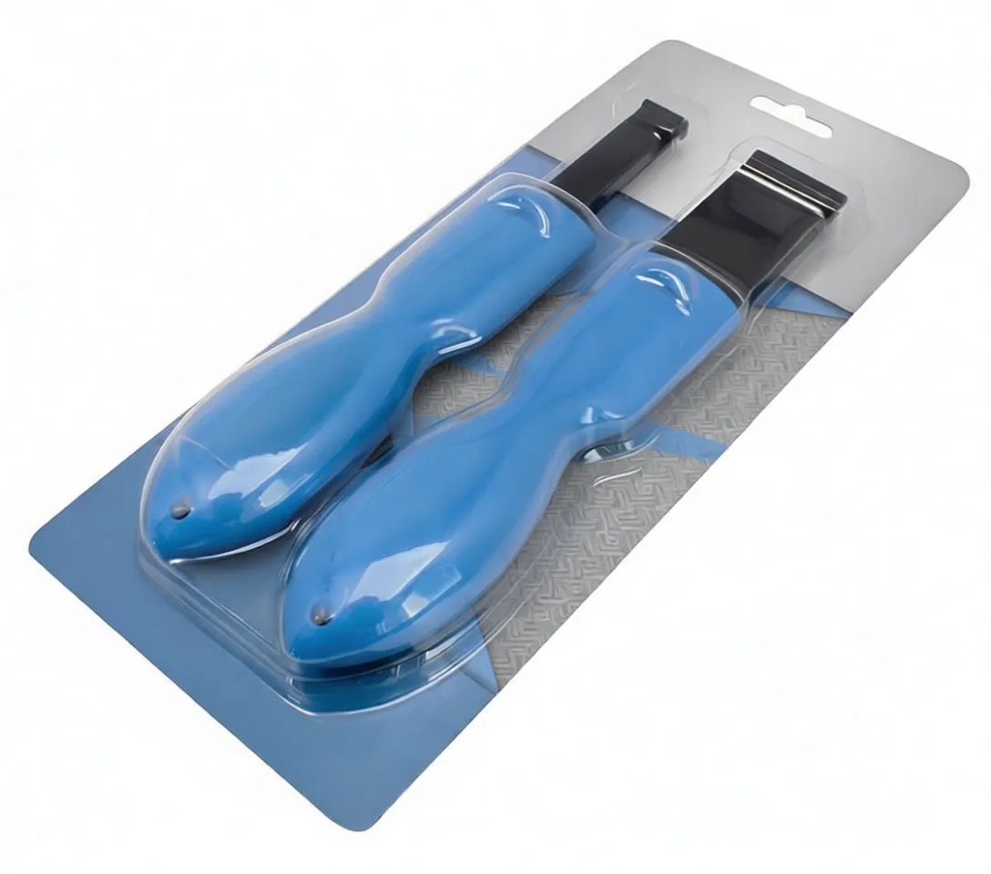 Two scrapers sealed in clear blister packaging on a printed card backing, showing handles and blade tips with a '2pcs' marker.