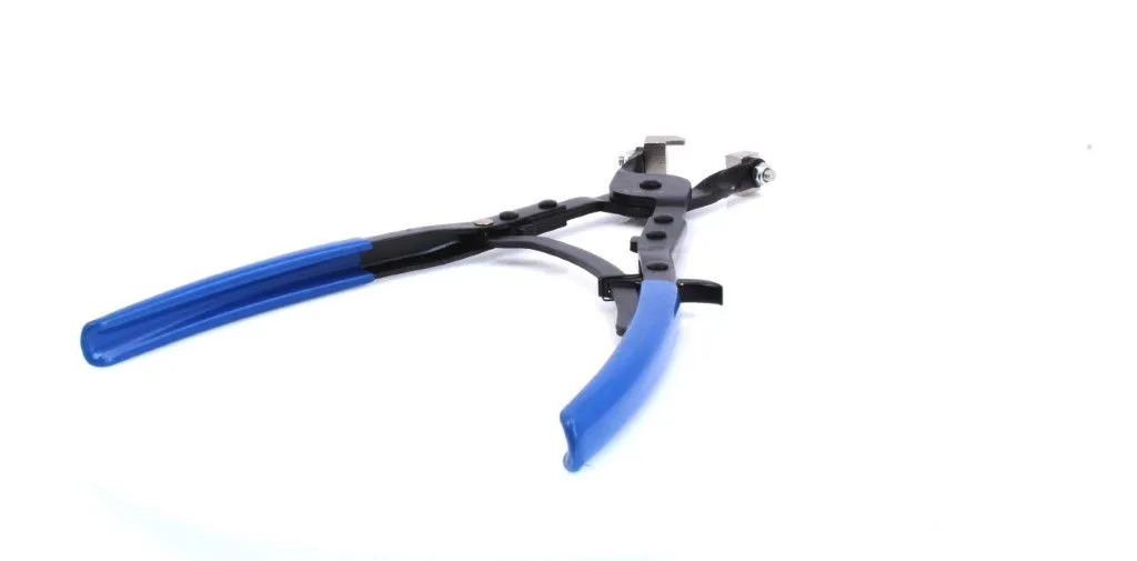 Low-angle view of pliers showing blue handles, black linkage and metal jaw tips in the distance