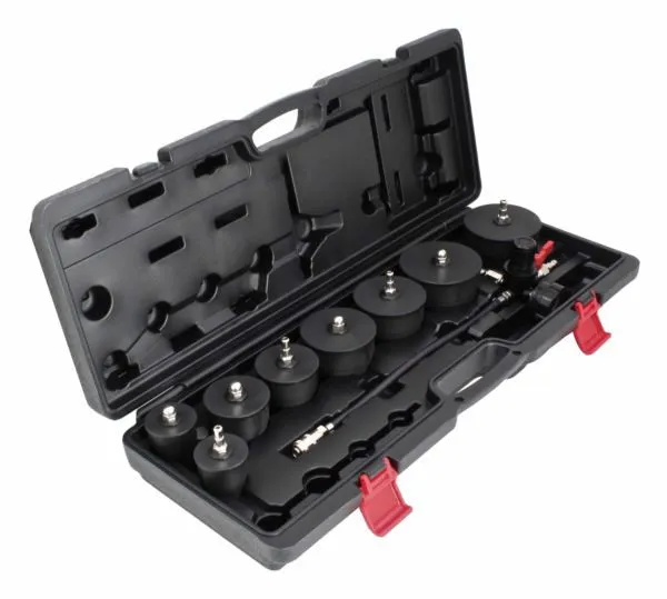 Angled shot of case with rubber caps, metal extension, hose and regulator assembly, red latch