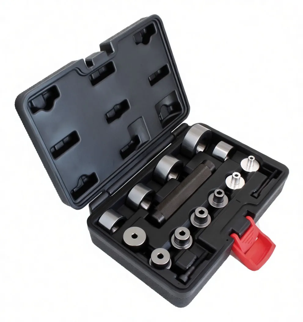 Angled view of bearing driver kit in molded case showing labeled metal driver cups, knurled handle, silver adapters and red latch.