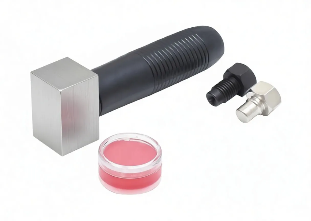 Flaring tool handle with head, grease pot and two interchangeable punches on white background