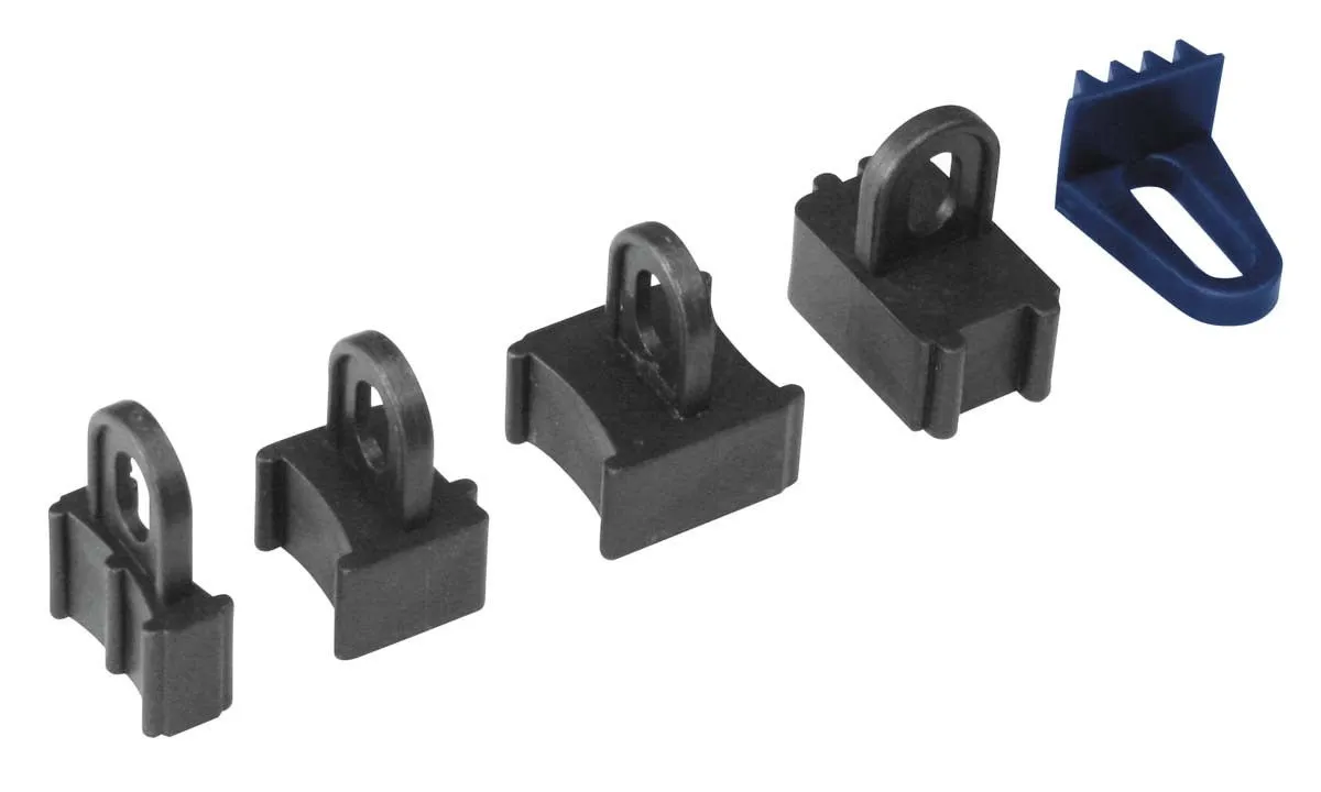 Row of four black plastic locking blocks with looped tabs and a blue serrated wedge adapter.
