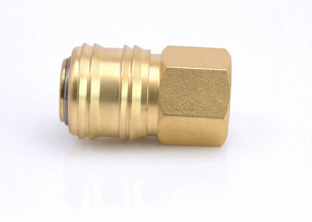 Side view of brass quick connector showing hex nut, grooved sleeve and stamped marking