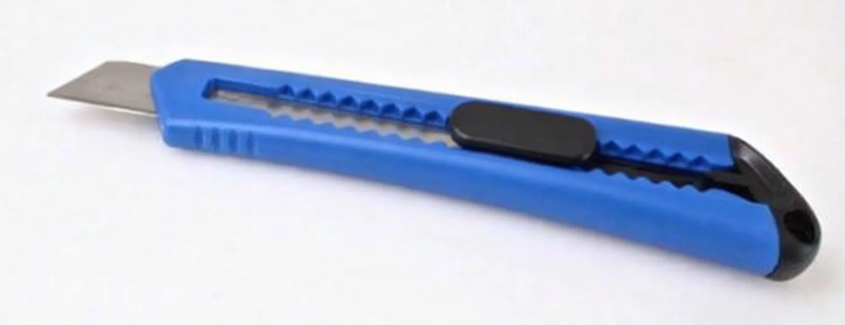 Utility knife with blade extended, blue handle, black slider and end-cap lanyard hole