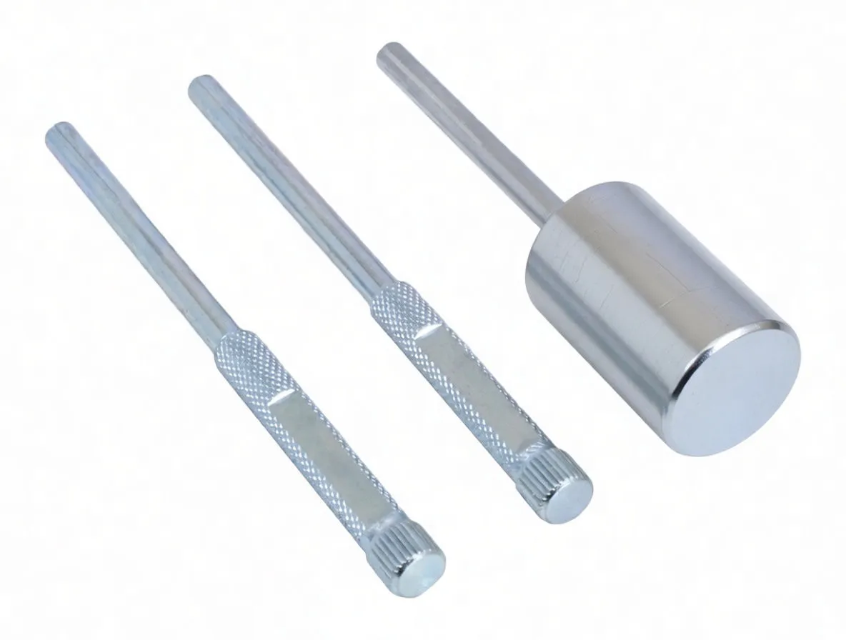 Three knurled alignment pins and a larger knurled adapter tool, silver plated