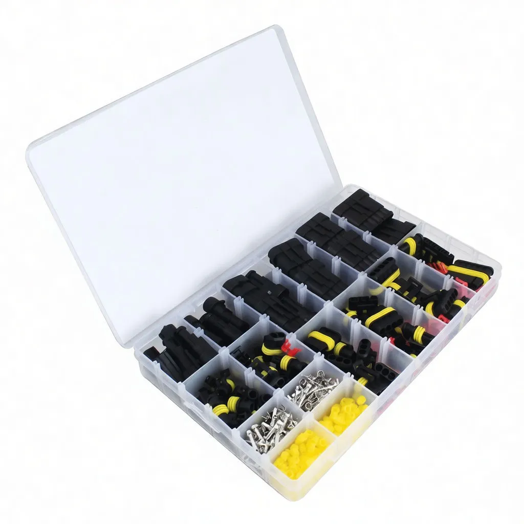 Angled open kit case displaying connector housings, yellow seals, metal pins and lid label with part pictures and piece counts.
