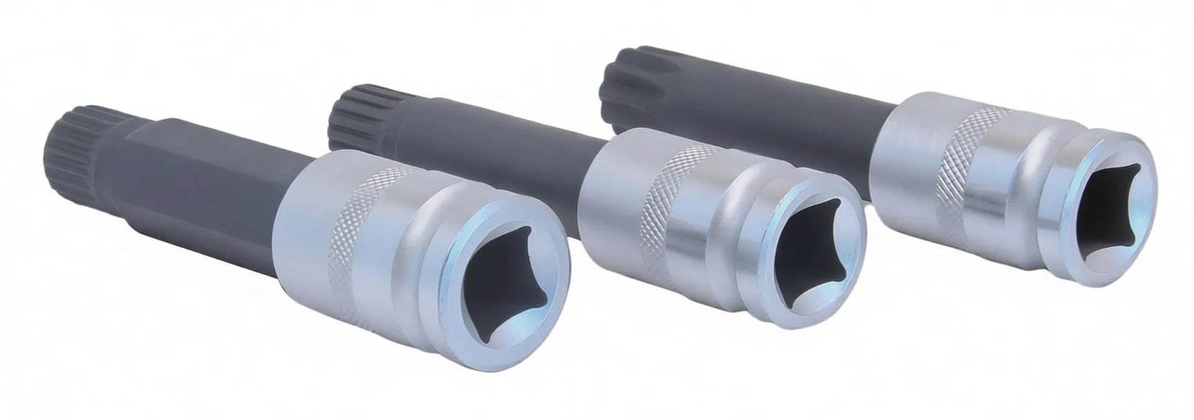 Three sockets on their sides showing internal four-lobed bores and a central retention ball, with black splined shafts and ASTA engraving.