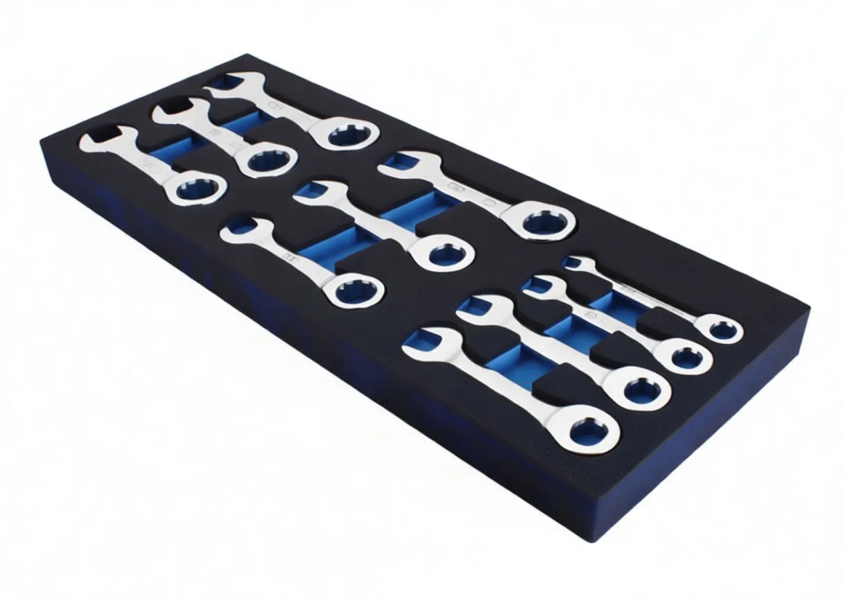 Top view of black foam tool tray with labeled cutouts holding chrome ratcheting wrenches and ASTA logo.