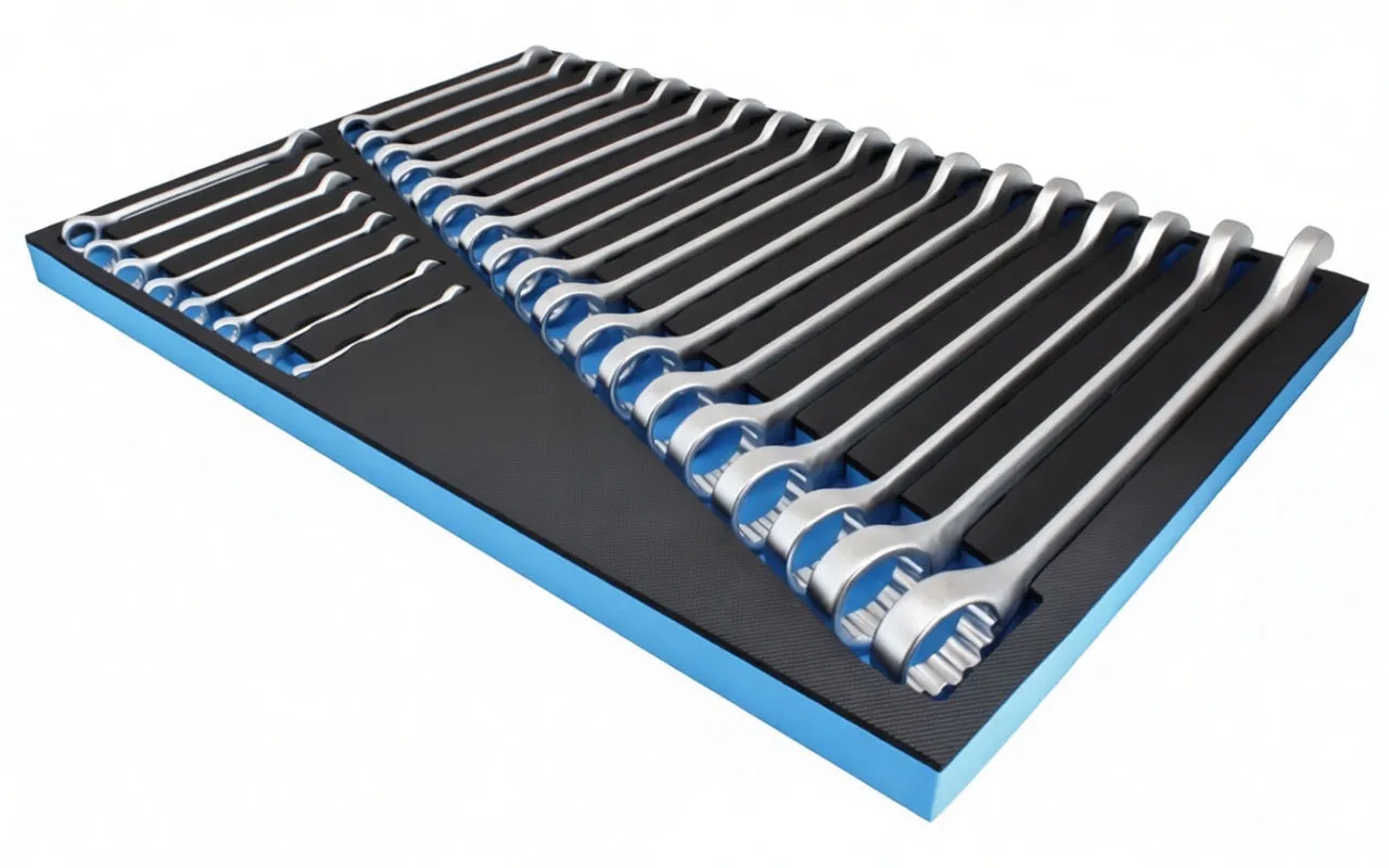 low angle perspective of foam tool tray filled with chrome combination wrenches showing ratchet ring ends and ASTA logo